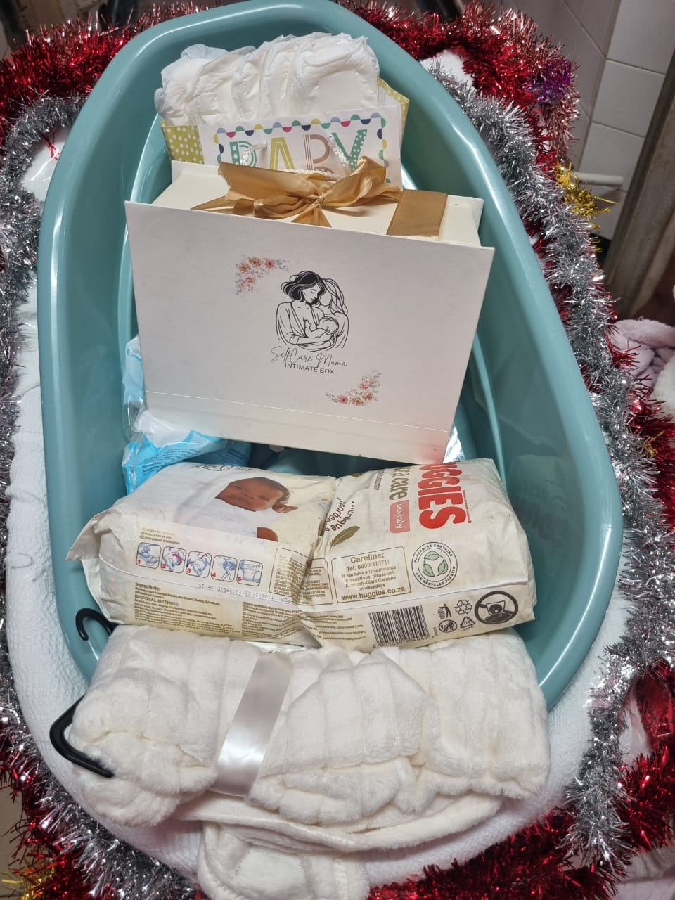 A SelfCare Mama Intimate Box postpartum care package