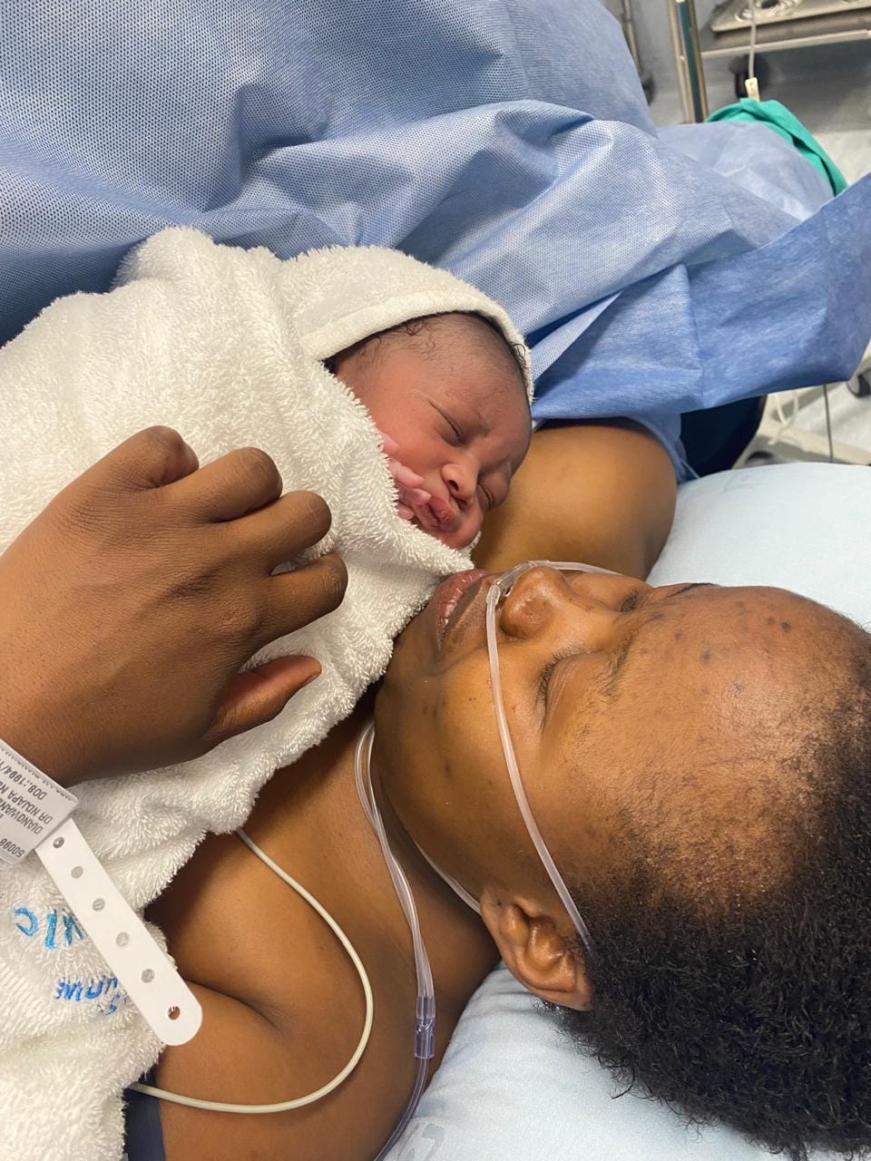 A mother holding her newborn skin-to-skin